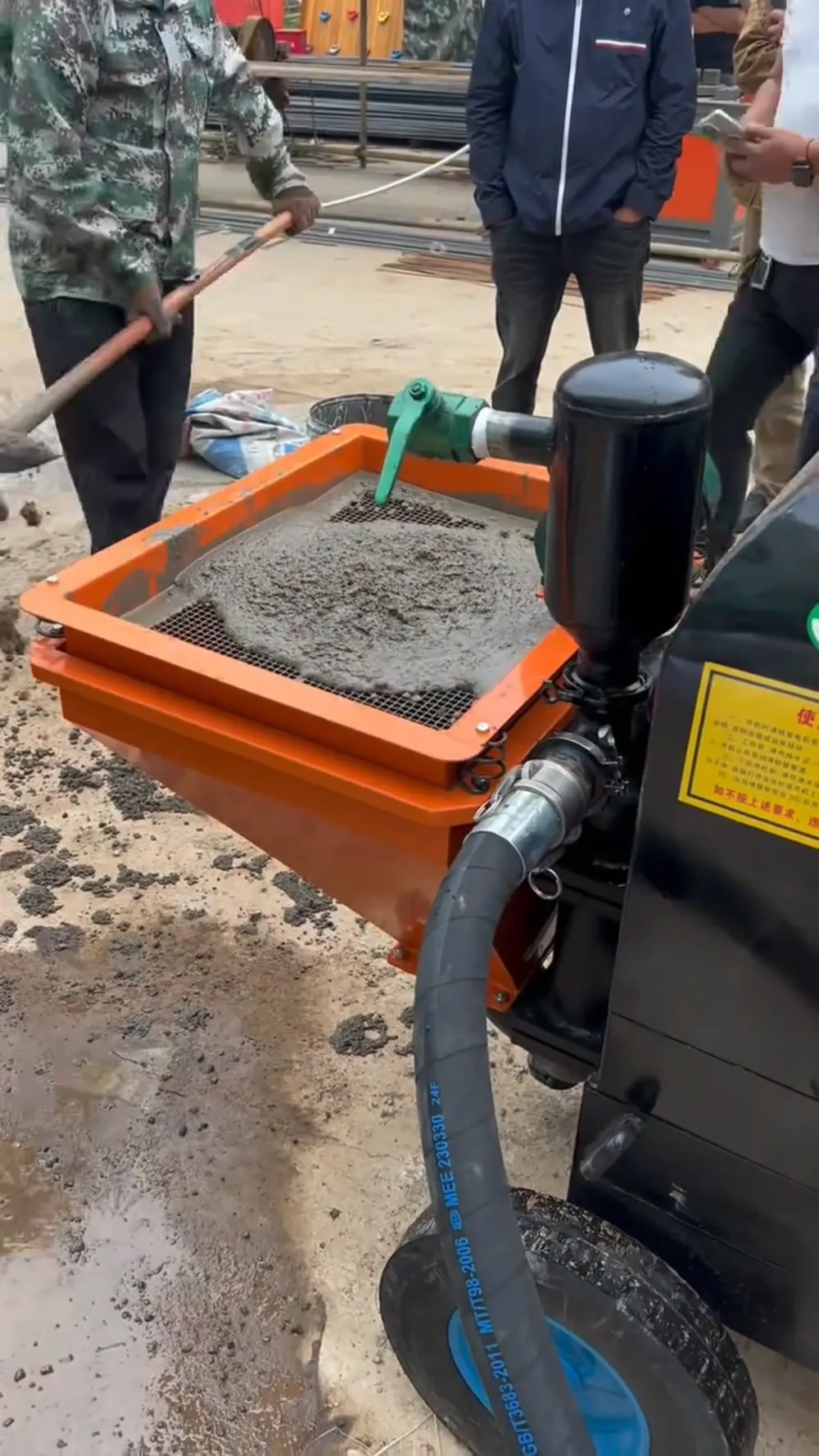 Mortar material being prepared for spraying